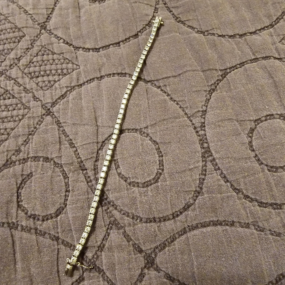 Sterling Silver and faux diamond tennis braclet.